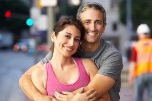 Couple embracing at a construction site