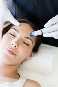 Woman getting hydrafacial procedure